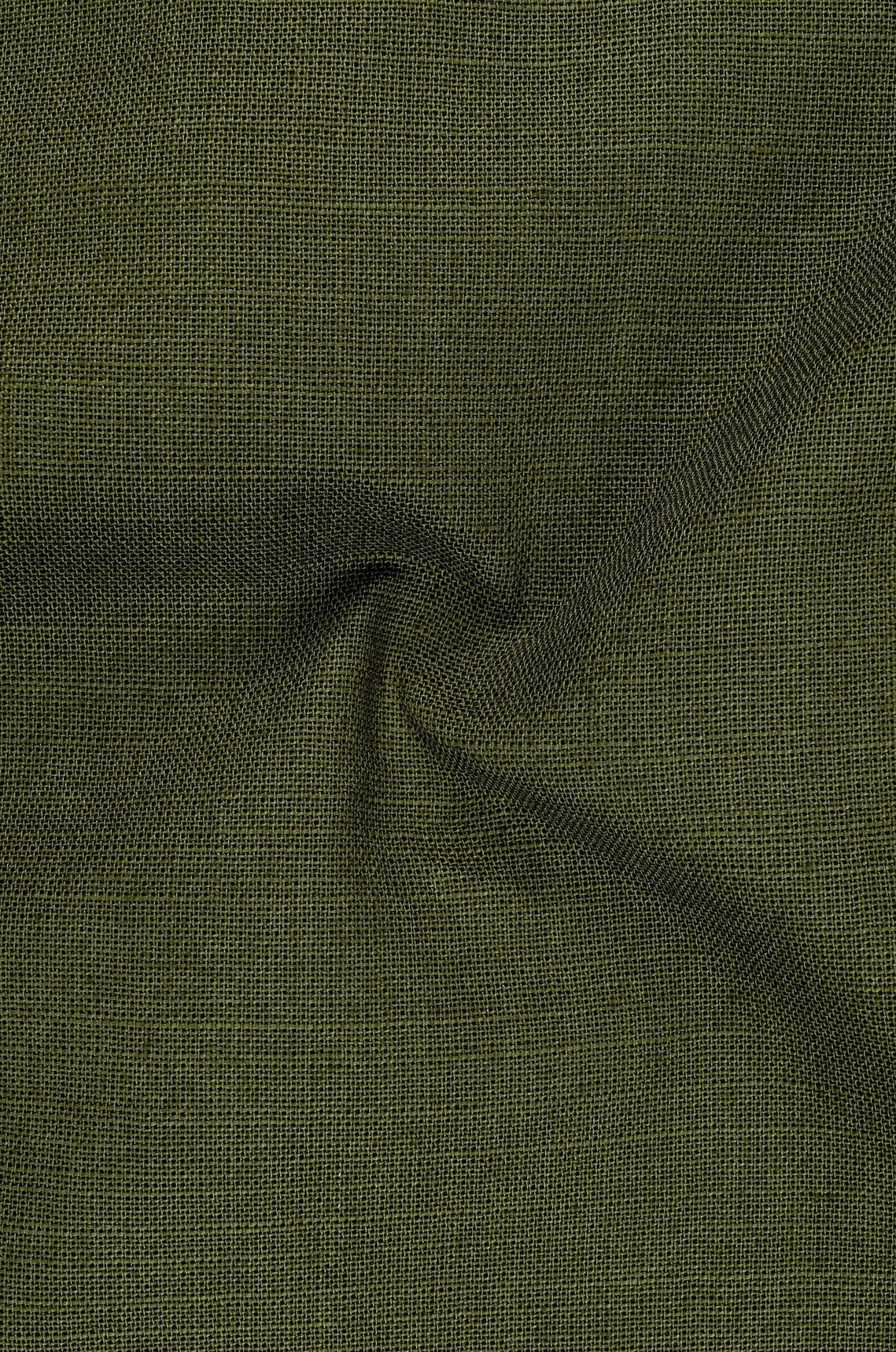 Close-up of green fabric with a subtle texture