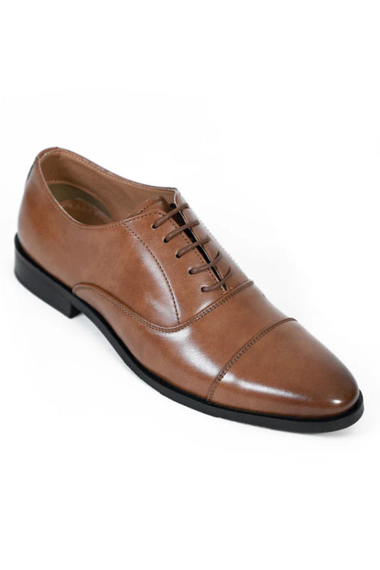 Brown leather dress shoe on a white background