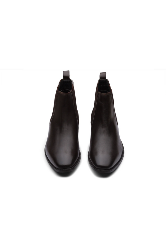 Pair of black leather Chelsea boots on a white background