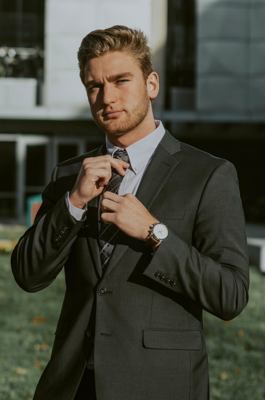 Bespoke tailor fitting a suit jacket