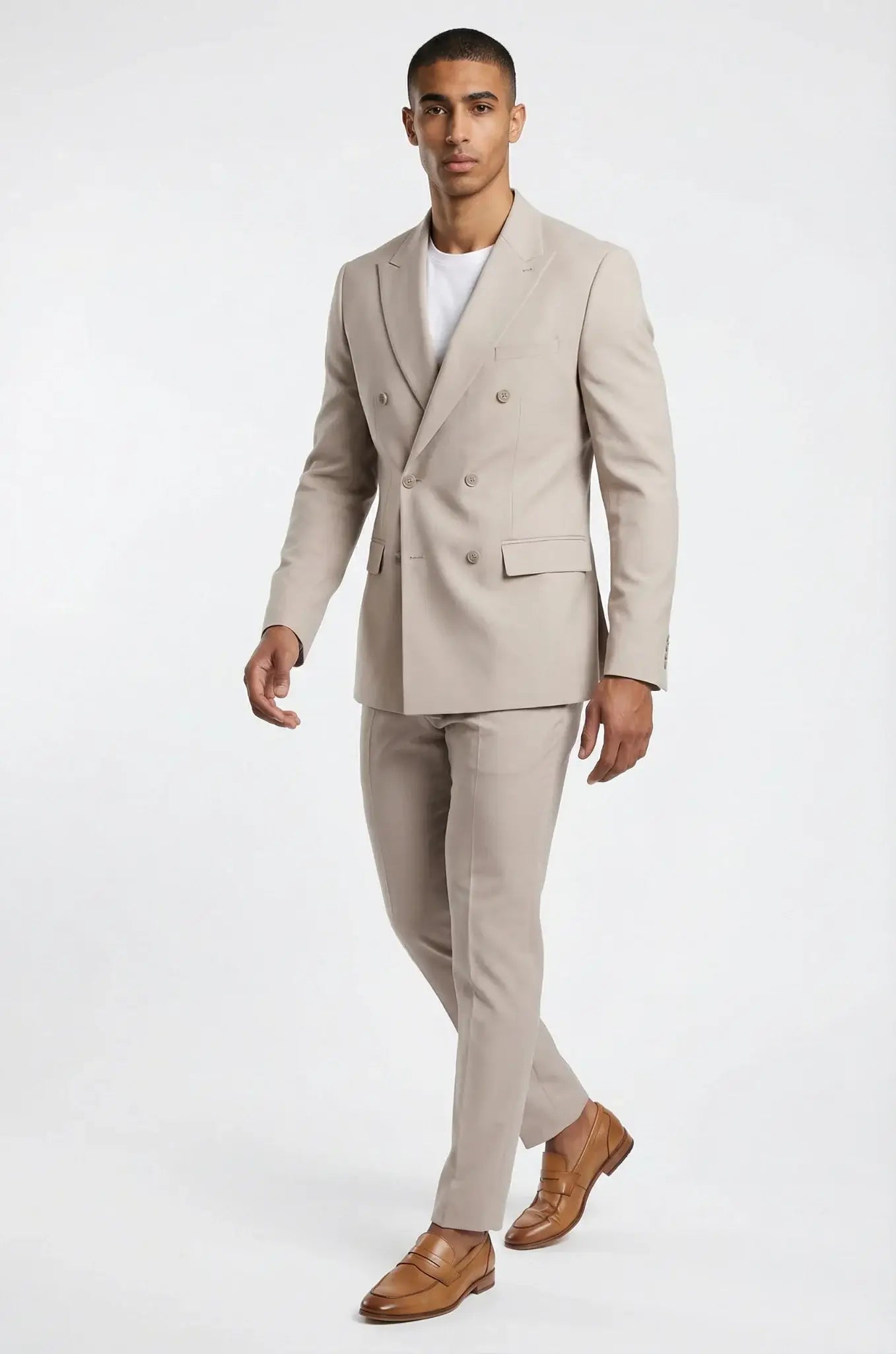Beige Double Breasted 2-Piece Suit – a refined beige ensemble crafted in a premium Italian wool blend, featuring a bespoke tailored double-breasted blazer and matching trousers for a sharp, structured silhouette and timeless sophistication.