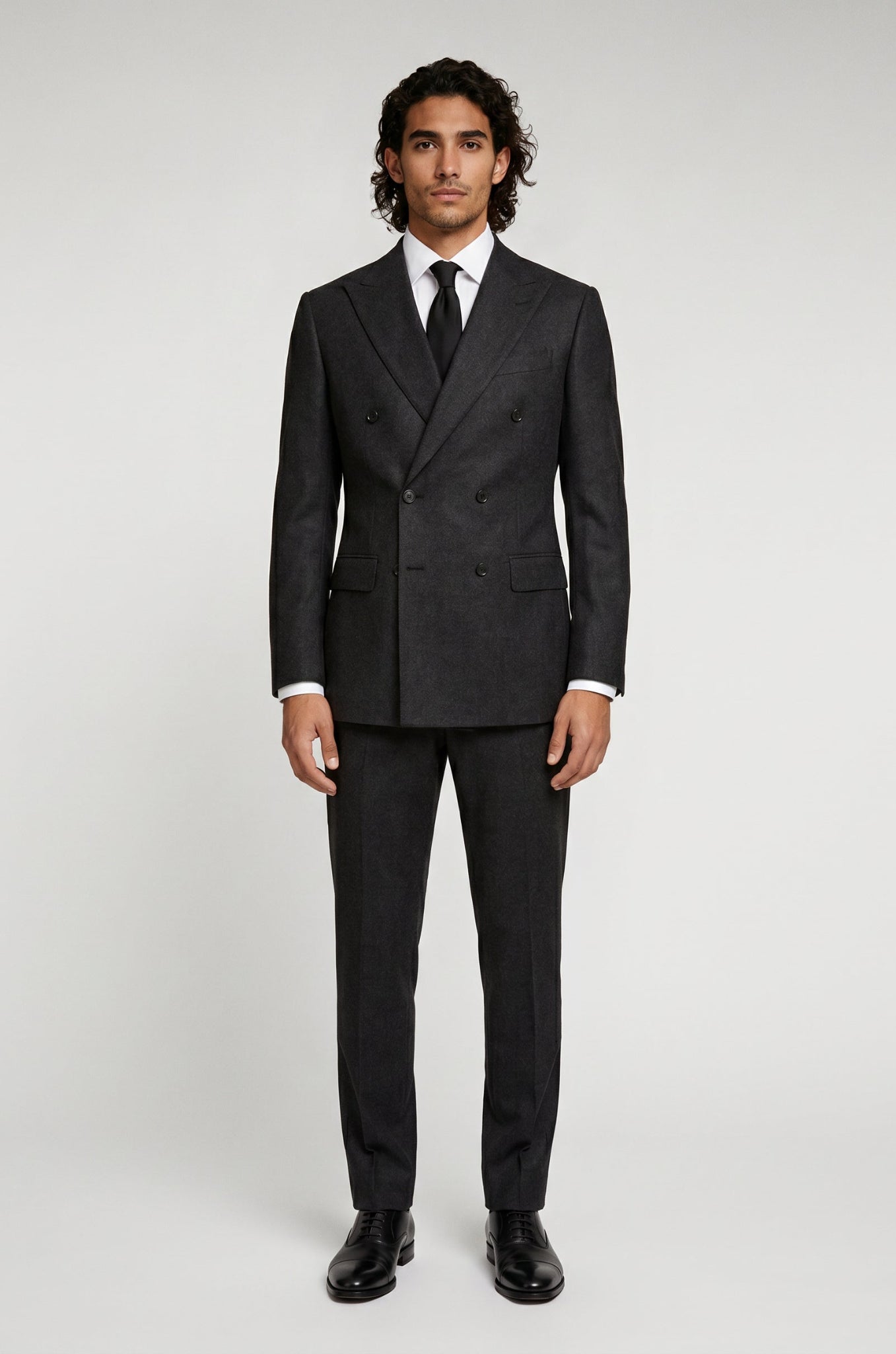 Men's Blutailor Black Double-Breasted Suit crafted from premium terry rayon fabric, featuring a classic black finish, double-breasted blazer with peak lapels, matching tailored trousers, structured silhouette, and refined craftsmanship, ideal for business wear, weddings, black-tie events, formal occasions, and sophisticated evening dressing.