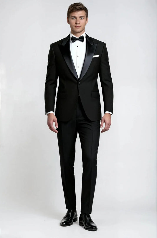 Black Peak Lapel 3-Piece Tuxedo – a classic black ensemble featuring a custom tailored peak lapel blazer, matching waistcoat, and trousers, crafted for a sharp, structured silhouette and timeless black-tie elegance.