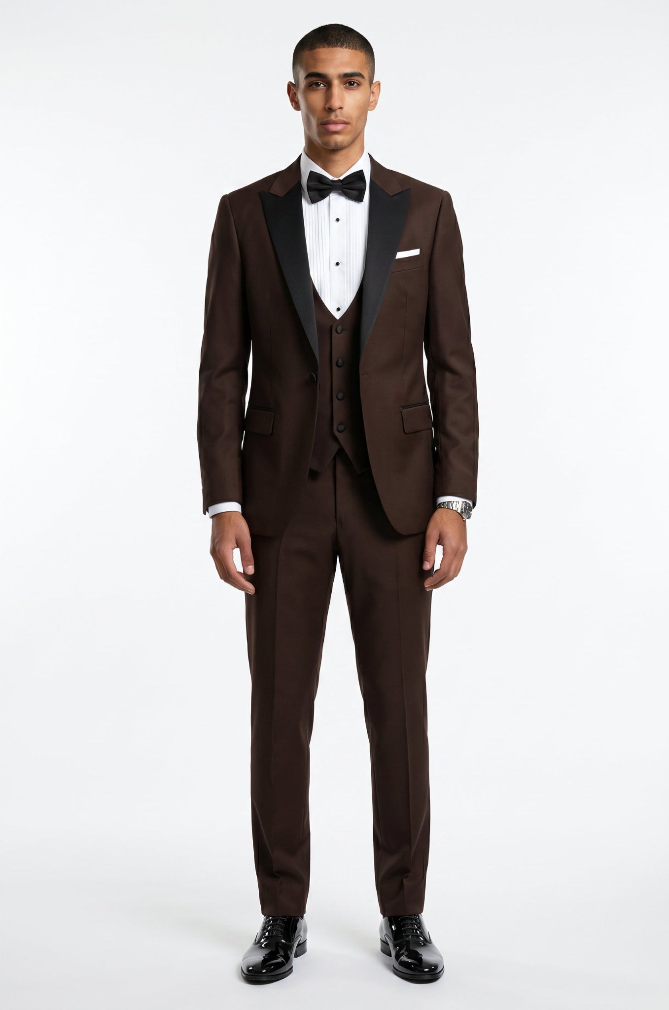 Blutailor chocolate brown peak lapel 3 piece tuxedo in premium fabric with a custom tailored fit, featuring a sleek blazer, waistcoat, and trousers for a rich and sophisticated formal look.