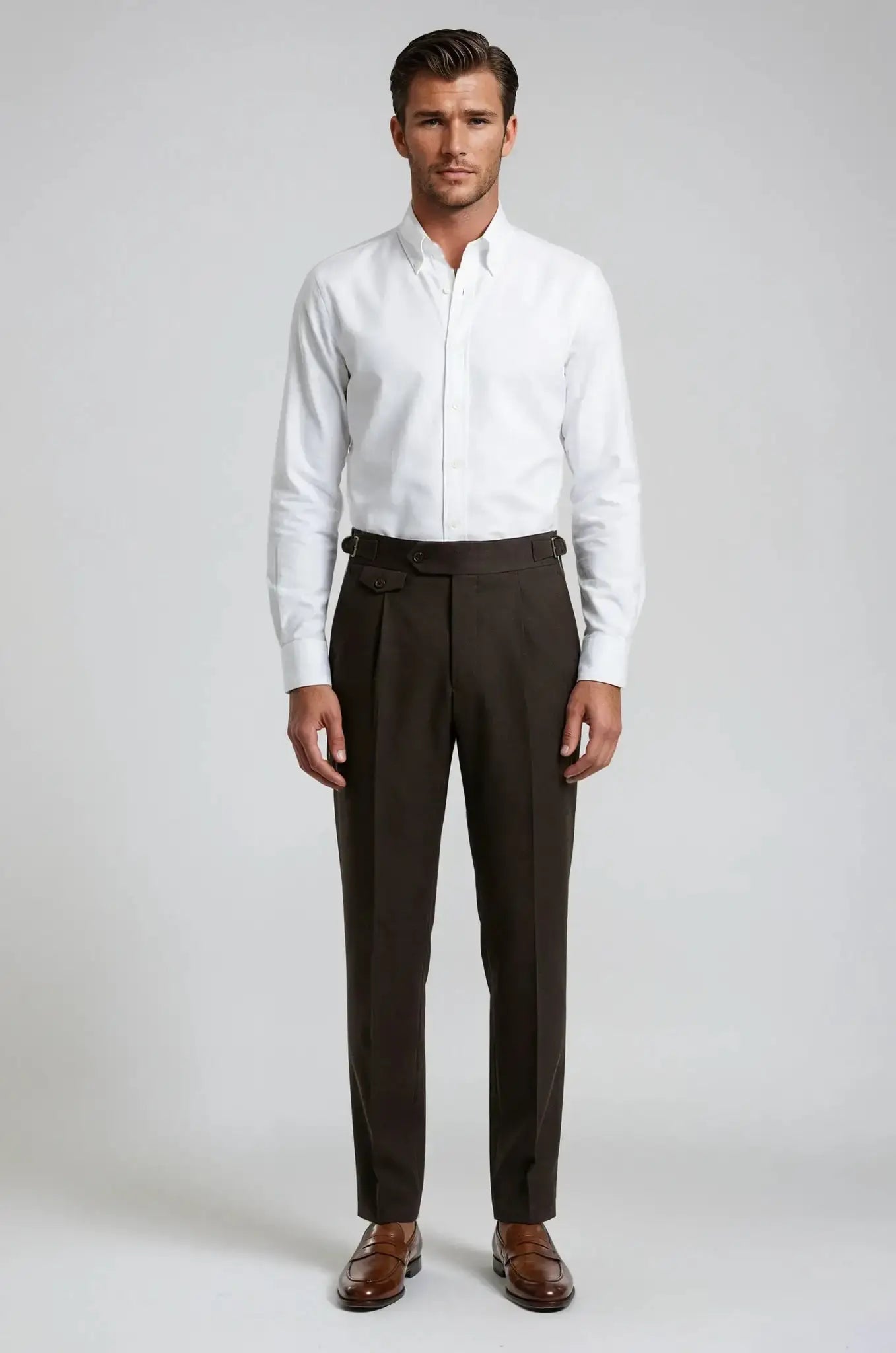 Blutailor Dark Brown Gurkha Pants – a sophisticated dark brown trouser featuring a custom high-waisted Gurkha design with adjustable side tabs, tailored for a sharp, structured fit and timeless elegance.
