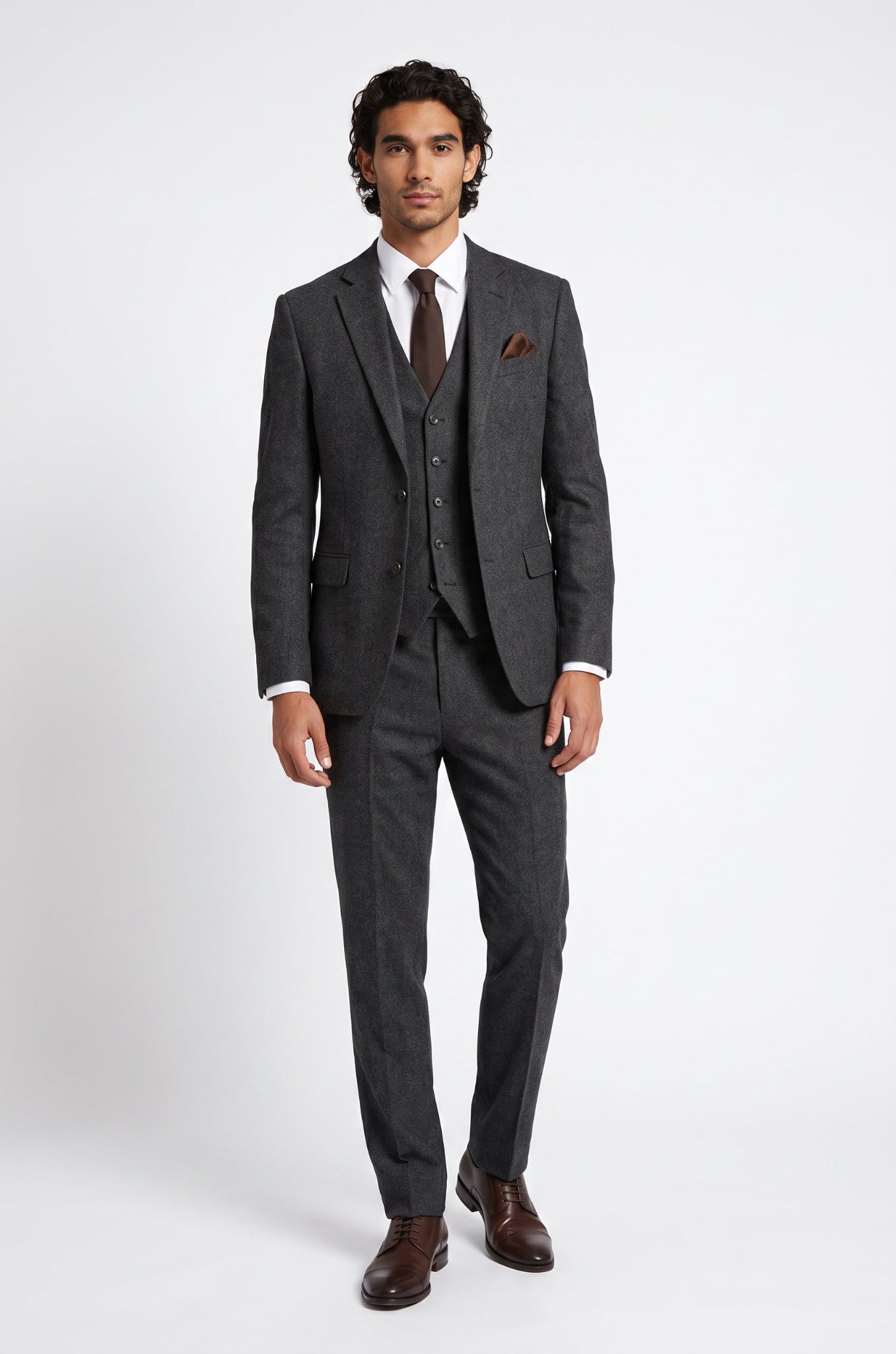 Men's Blutailor Kensington Charcoal 3-Piece Suit from the Luxury Collection, crafted from premium 100% non-mulesed Super 100's Worsted Wool, featuring a rich charcoal finish, tailored blazer, matching waistcoat, and formal trousers for timeless elegance and refined sophistication.