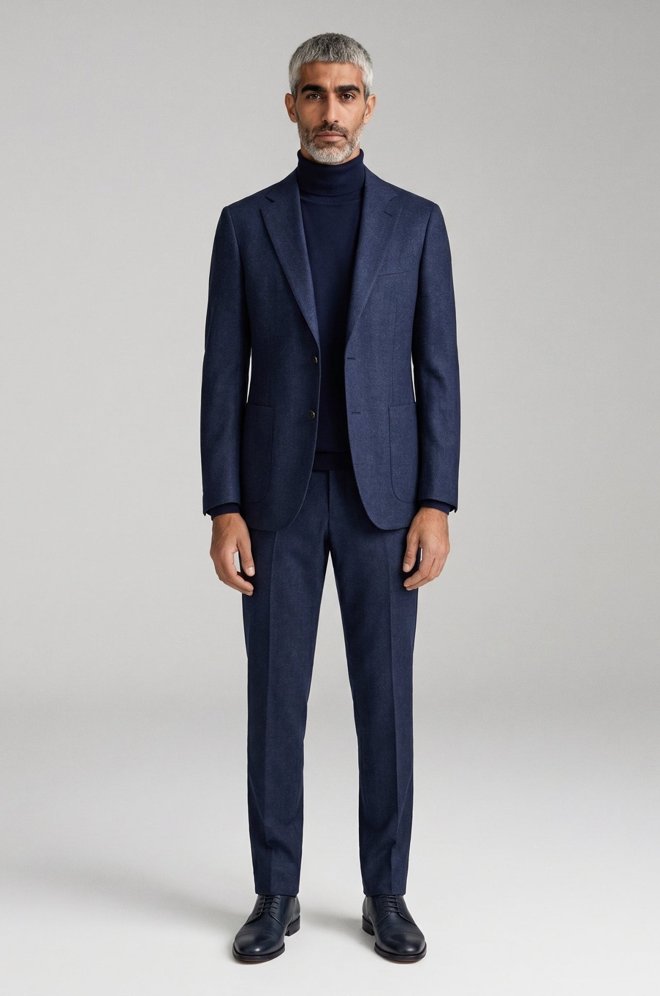 Men's Blutailor Navy Blue Textured Blazer crafted from a premium terry rayon blend, featuring a rich navy blue textured finish, tailored fit, structured silhouette, classic notch lapel, and refined detailing, offering a sophisticated look ideal for business wear, weddings, evening events, and elevated occasion dressing.