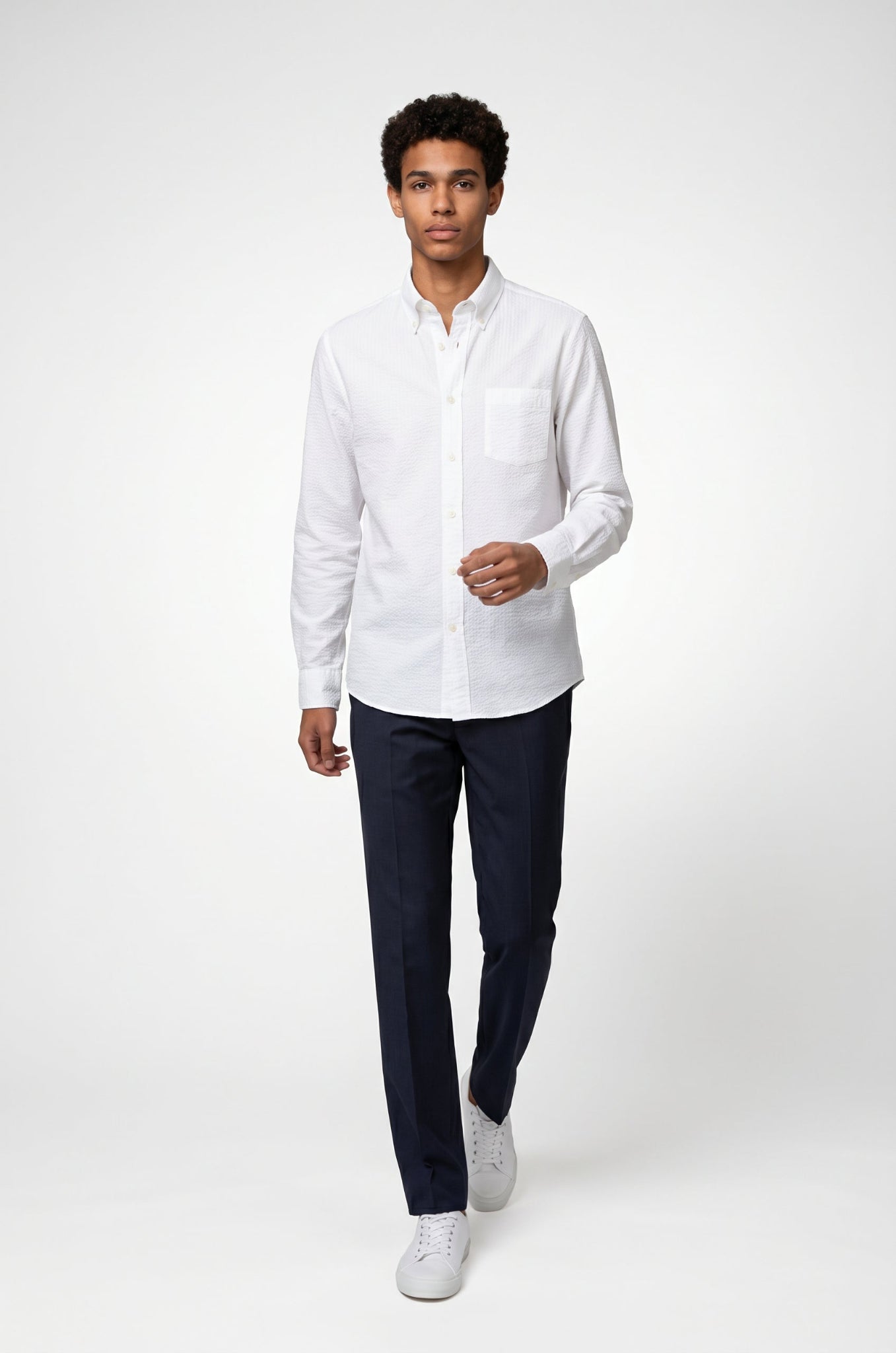 Blutailor white seersucker cotton shirt in lightweight textured fabric with a custom tailored fit, designed for breathable comfort and a crisp summer look.

