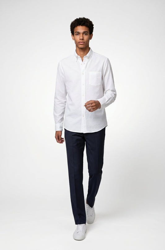 Blutailor white seersucker cotton shirt in lightweight textured fabric with a custom tailored fit, designed for breathable comfort and a crisp summer look.
