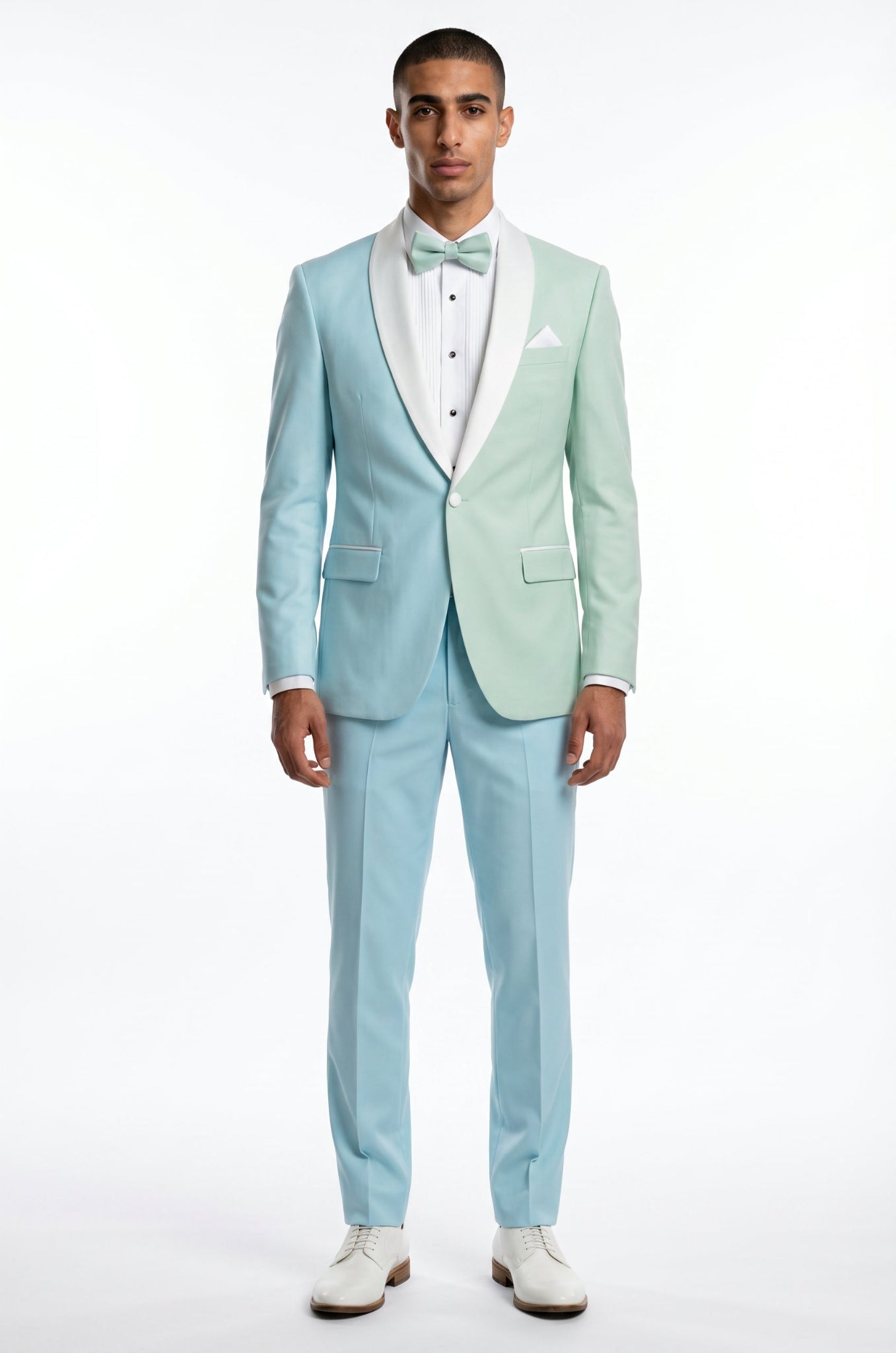 Man wearing a light blue tuxedo with a white shirt and bow tie on a white background